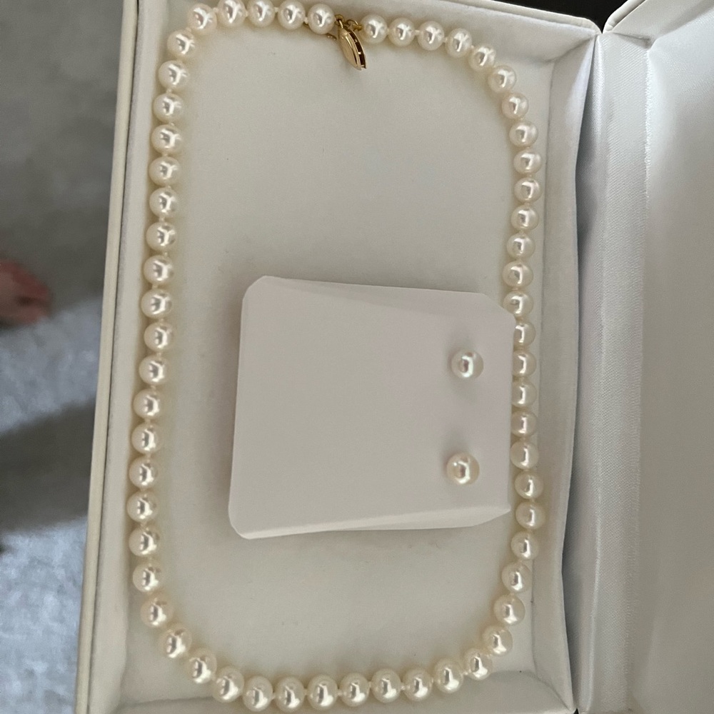 Wore to my wedding. Used one time. Matching pearl necklace and earrings.
